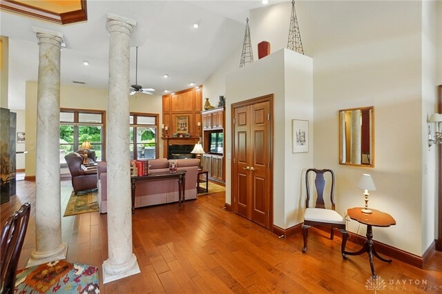 1106 Roger Scott Dr, Bellbrook, OH 45305 - hall with ornate columns, a towering ceiling, wood-type flooring, and recessed lighting