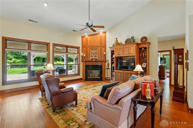 1106 Roger Scott Dr, Bellbrook, OH 45305 - living room featuring a ceiling fan, hardwood / wood-style floors, recessed lighting, and a glass covered fireplace