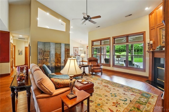 1106 Roger Scott Dr, Bellbrook, OH 45305 - living room with ceiling fan, hardwood / wood-style flooring, a fireplace with flush hearth, recessed lighting, and a towering ceiling