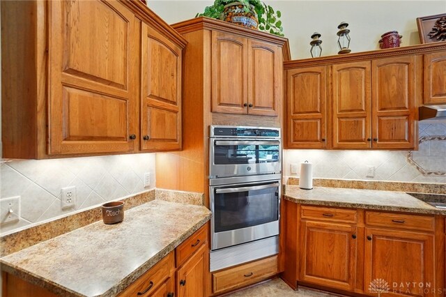 1106 Roger Scott Dr, Bellbrook, OH 45305 - kitchen featuring stainless steel double oven and brown cabinetry
