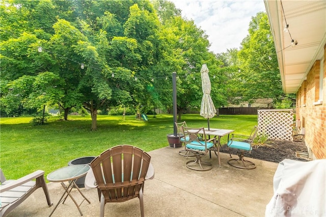 2435 S County Road 25a, Troy, OH 45373 - view of patio with a playground and outdoor dining space