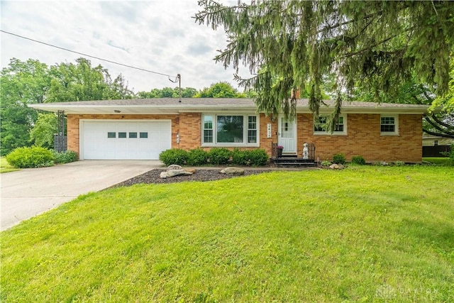 2435 S County Road 25a, Troy, OH 45373 - ranch-style home featuring an attached garage, driveway, a front yard, and brick siding
