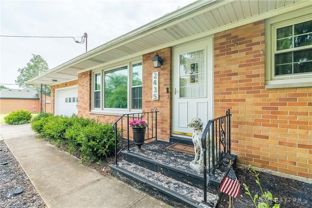 2435 S County Road 25a, Troy, OH 45373 - property entrance featuring brick siding and a garage
