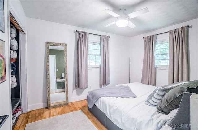 2435 S County Road 25a, Troy, OH 45373 - bedroom with light wood-style flooring, ceiling fan, and a closet