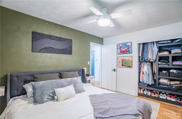 2435 S County Road 25a, Troy, OH 45373 - bedroom featuring wood finished floors, ceiling fan, and a textured wall