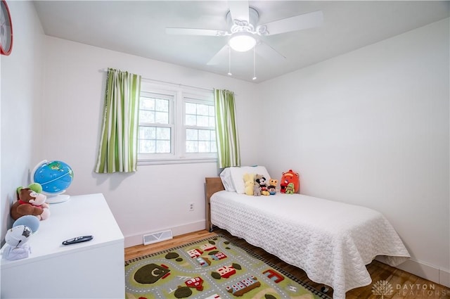 2435 S County Road 25a, Troy, OH 45373 - bedroom with wood finished floors and ceiling fan