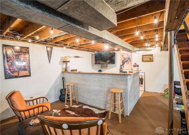 2435 S County Road 25a, Troy, OH 45373 - indoor dry bar with finished concrete floors and stairway
