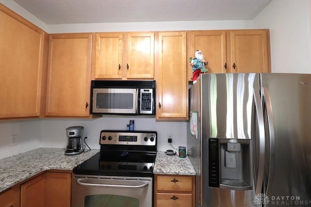 3224 Grand Falls Blvd, Maineville, OH 45039 - kitchen featuring stainless steel appliances and light stone counters