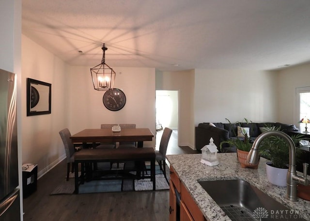 3224 Grand Falls Blvd, Maineville, OH 45039 - dining space featuring dark wood-style floors and a chandelier