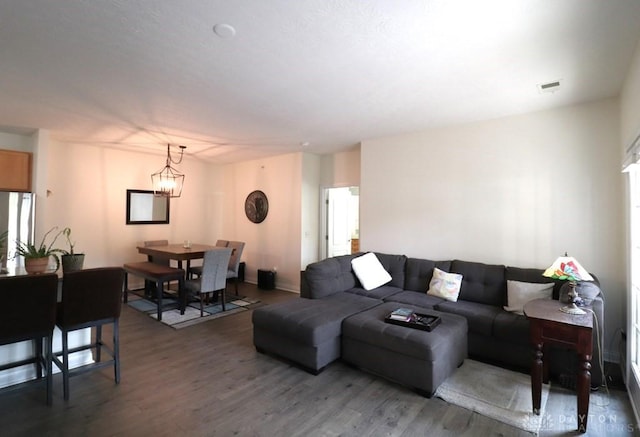 3224 Grand Falls Blvd, Maineville, OH 45039 - living area with wood finished floors and a chandelier