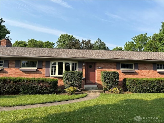 215 W Martindale Rd, Englewood, OH 45322 - ranch-style house with brick siding, a front lawn, and a chimney