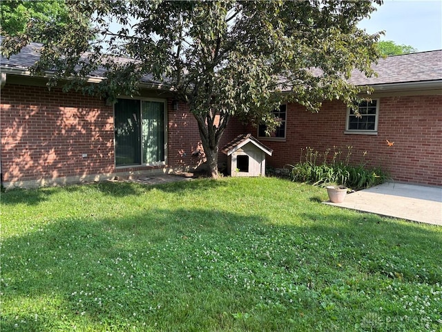 215 W Martindale Rd, Englewood, OH 45322 - view of grassy yard with a patio