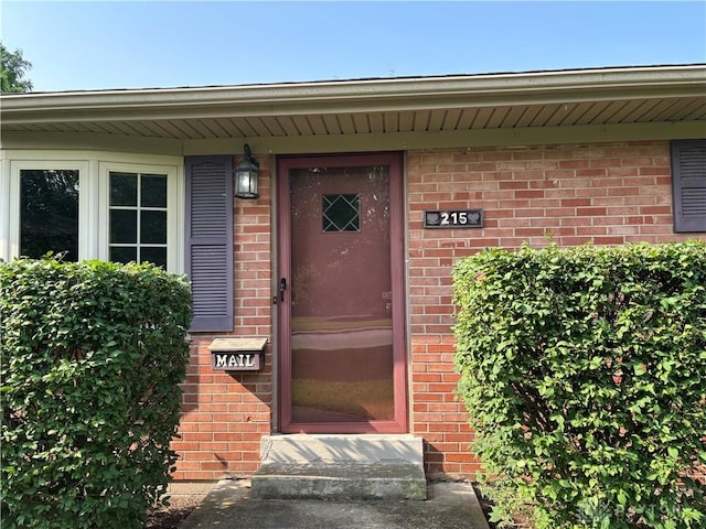 215 W Martindale Rd, Englewood, OH 45322 - doorway to property featuring brick siding