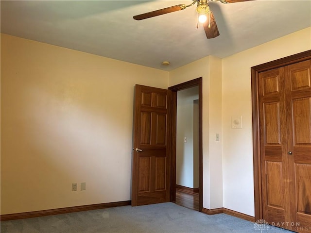 215 W Martindale Rd, Englewood, OH 45322 - unfurnished bedroom featuring carpet, a closet, and ceiling fan