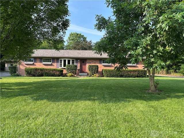 215 W Martindale Rd, Englewood, OH 45322 - ranch-style house with brick siding and a front yard