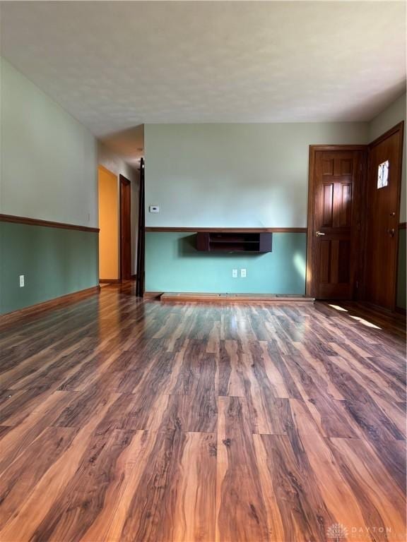 215 W Martindale Rd, Englewood, OH 45322 - unfurnished living room featuring wood finished floors and a fireplace