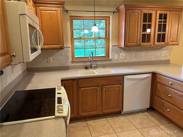 215 W Martindale Rd, Englewood, OH 45322 - kitchen featuring white appliances, brown cabinetry, and light countertops