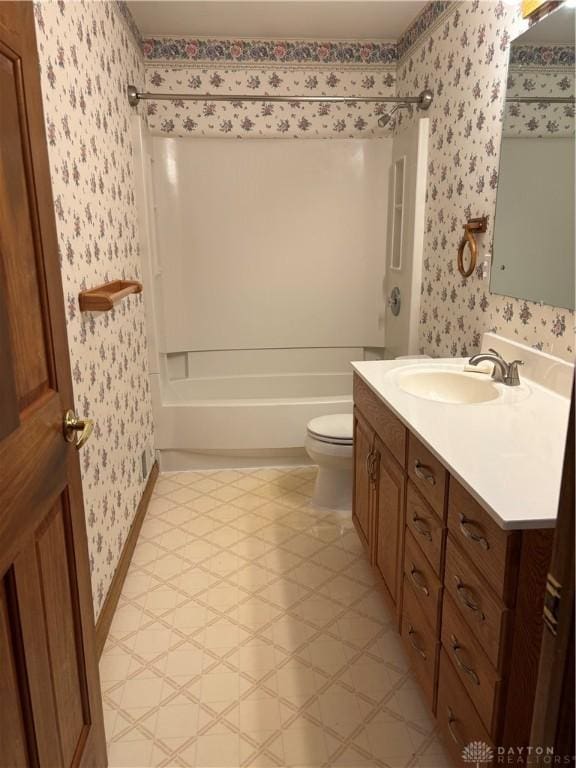 215 W Martindale Rd, Englewood, OH 45322 - bathroom featuring wallpapered walls, vanity, shower / washtub combination, and tile patterned floors