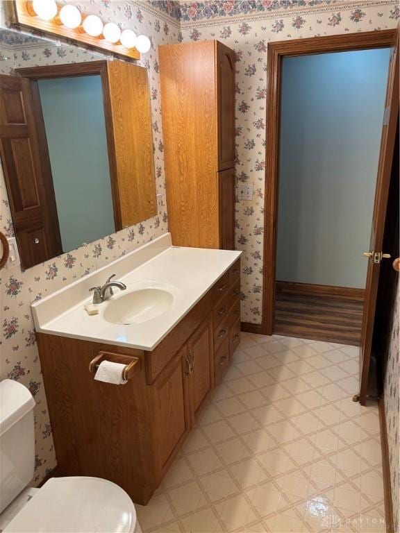 215 W Martindale Rd, Englewood, OH 45322 - bathroom with wallpapered walls, vanity, and tile patterned floors