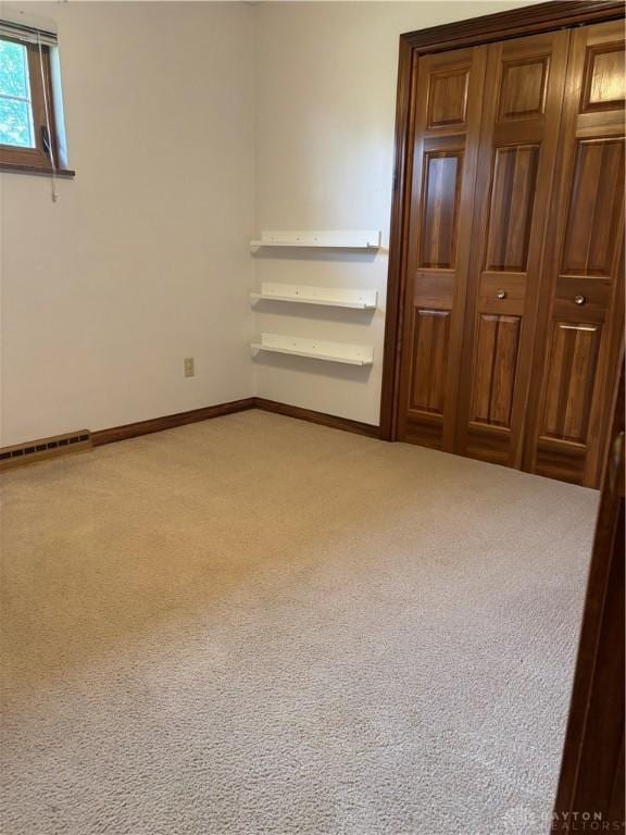 215 W Martindale Rd, Englewood, OH 45322 - unfurnished bedroom featuring carpet floors and a closet