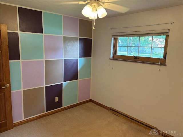 215 W Martindale Rd, Englewood, OH 45322 - unfurnished bedroom featuring baseboard heating, carpet, and ceiling fan