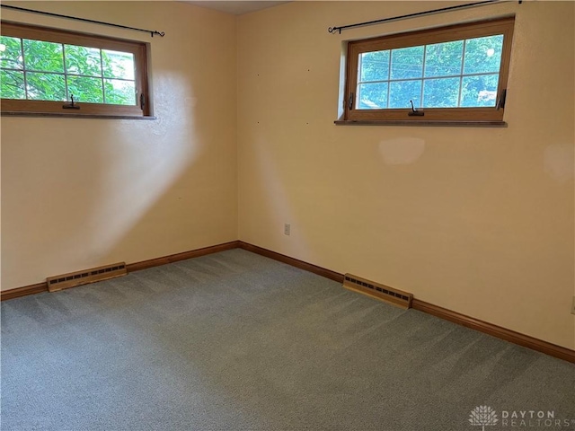 215 W Martindale Rd, Englewood, OH 45322 - empty room featuring carpet flooring and plenty of natural light