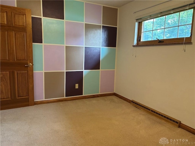 215 W Martindale Rd, Englewood, OH 45322 - unfurnished bedroom featuring a baseboard heating unit and carpet flooring