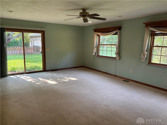 215 W Martindale Rd, Englewood, OH 45322 - carpeted empty room with baseboards and a ceiling fan
