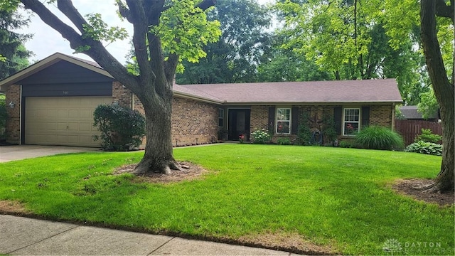 5468 Split Rock Dr, Dayton, OH 45424 - ranch-style home featuring brick siding, an attached garage, and driveway