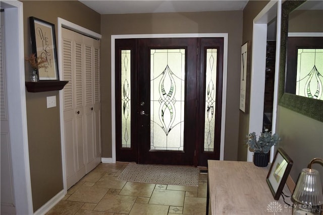 5468 Split Rock Dr, Dayton, OH 45424 - foyer with baseboards and stone tile flooring