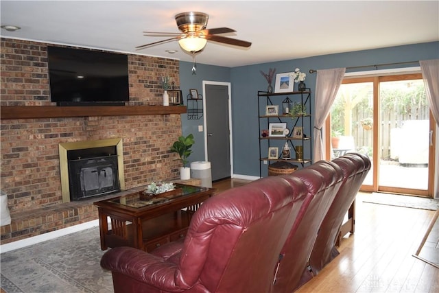 5468 Split Rock Dr, Dayton, OH 45424 - living area with a brick fireplace, ceiling fan, and wood finished floors