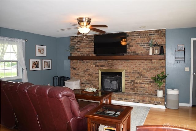 5468 Split Rock Dr, Dayton, OH 45424 - living room with a ceiling fan, wood finished floors, and a fireplace