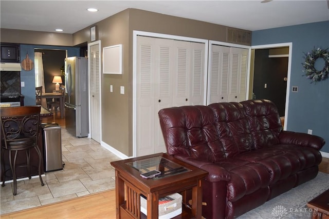 5468 Split Rock Dr, Dayton, OH 45424 - living room with baseboards and light wood-style floors