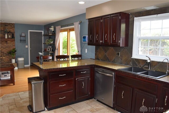 5468 Split Rock Dr, Dayton, OH 45424 - kitchen featuring stainless steel dishwasher, a peninsula, decorative backsplash, light stone finish flooring, and recessed lighting
