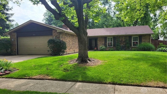 5468 Split Rock Dr, Dayton, OH 45424 - ranch-style house featuring brick siding, a garage, and driveway