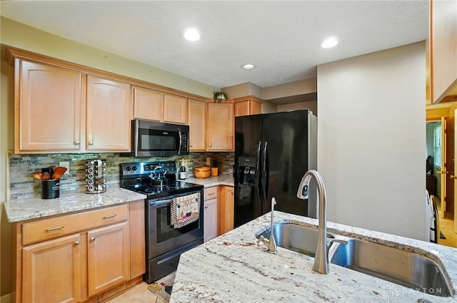 2946 Rockledge Trl, Beavercreek, OH 45430 - kitchen featuring black appliances, light stone countertops, backsplash, recessed lighting, and light brown cabinets