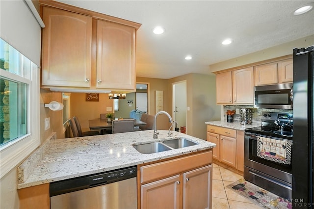 2946 Rockledge Trl, Beavercreek, OH 45430 - kitchen with stainless steel appliances, light brown cabinets, decorative backsplash, light stone countertops, and recessed lighting