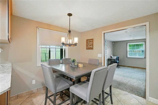 2946 Rockledge Trl, Beavercreek, OH 45430 - dining space with light tile patterned floors and a chandelier