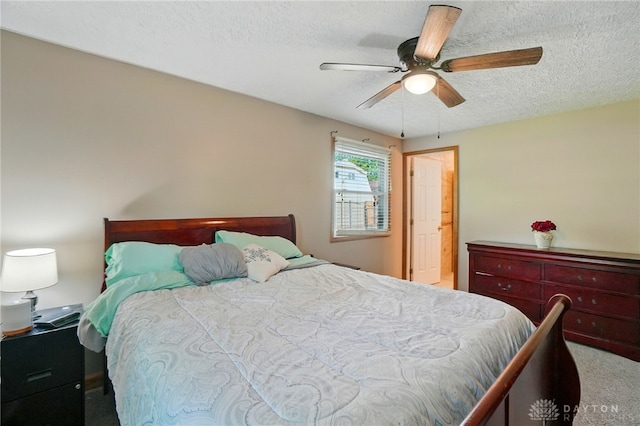 2946 Rockledge Trl, Beavercreek, OH 45430 - bedroom featuring carpet, a textured ceiling, and a ceiling fan