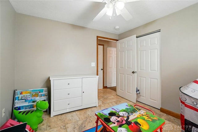 2946 Rockledge Trl, Beavercreek, OH 45430 - recreation room featuring ceiling fan and light stone finish flooring