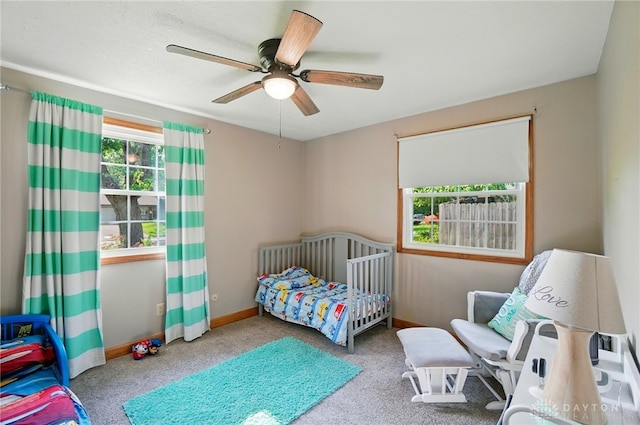 2946 Rockledge Trl, Beavercreek, OH 45430 - bedroom featuring carpet floors, a ceiling fan, and a crib