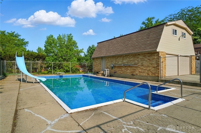 2946 Rockledge Trl, Beavercreek, OH 45430 - view of swimming pool with a water slide, a patio, and a diving board