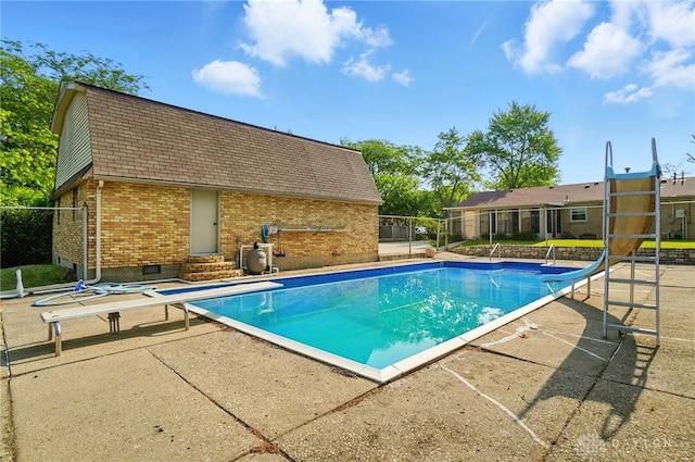 2946 Rockledge Trl, Beavercreek, OH 45430 - view of pool featuring a water slide, entry steps, a diving board, and a patio area