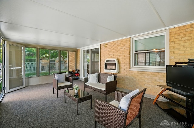 2946 Rockledge Trl, Beavercreek, OH 45430 - sunroom / solarium featuring heating unit, brick wall, carpet floors, and an outdoor hangout area