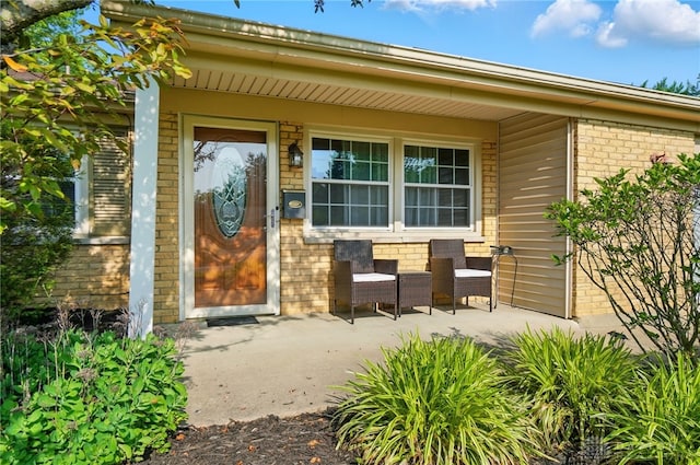 2946 Rockledge Trl, Beavercreek, OH 45430 - doorway to property featuring brick siding and covered porch