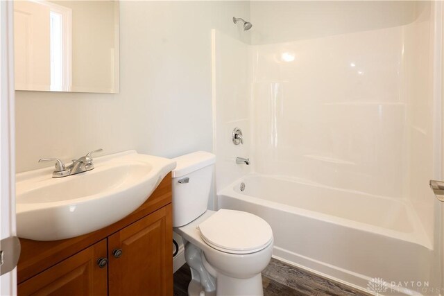 506 Linden Ave, Dayton, OH 45403 - bathroom with vanity, shower / bathtub combination, and wood finished floors