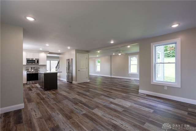 506 Linden Ave, Dayton, OH 45403 - unfurnished living room featuring plenty of natural light, dark wood-style floors, recessed lighting, and ceiling fan