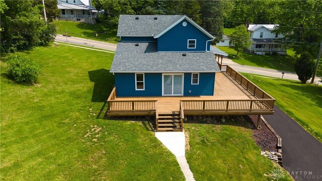 506 Linden Ave, Dayton, OH 45403 - rear view of house with roof with shingles, a lawn, and a deck