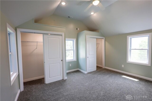 506 Linden Ave, Dayton, OH 45403 - unfurnished bedroom with vaulted ceiling, carpet flooring, a closet, multiple windows, and ceiling fan