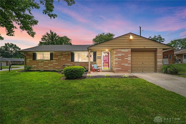 75 Royal Dr, Springboro, OH 45066 - single story home featuring concrete driveway, a lawn, a garage, and brick siding